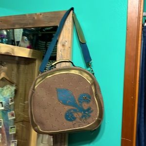 Cute carry on bag / adorned with fleur de lis accent